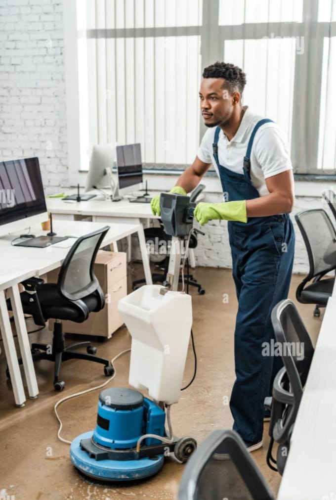Professional cleaner mopping floor in office - Eslim Cleaning Services