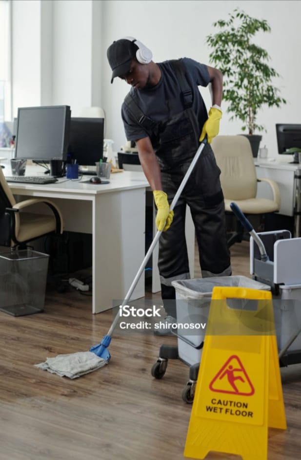 Professional cleaner operating floor polishing machine - Eslim Cleaning Services